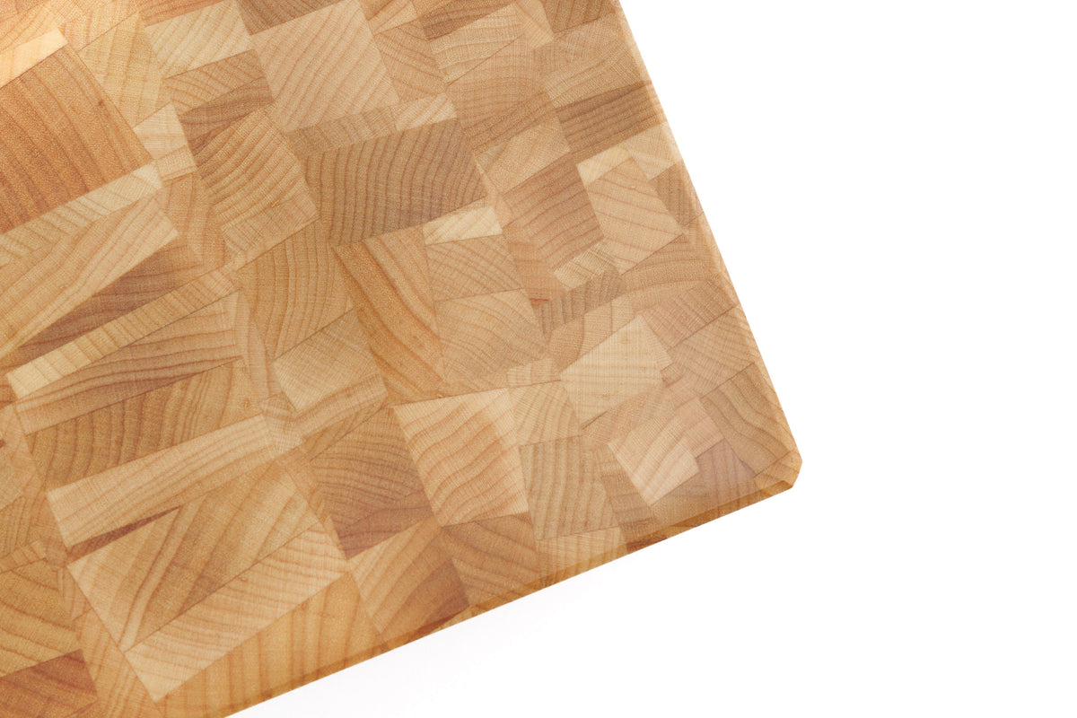 Close-up corner of Maple Mosaic end grain cutting board with intricate block pattern