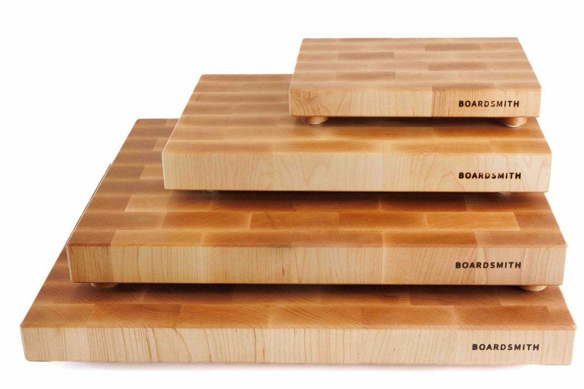 Stacked Maple Mosaic end grain cutting boards in four sizes by The Boardsmith