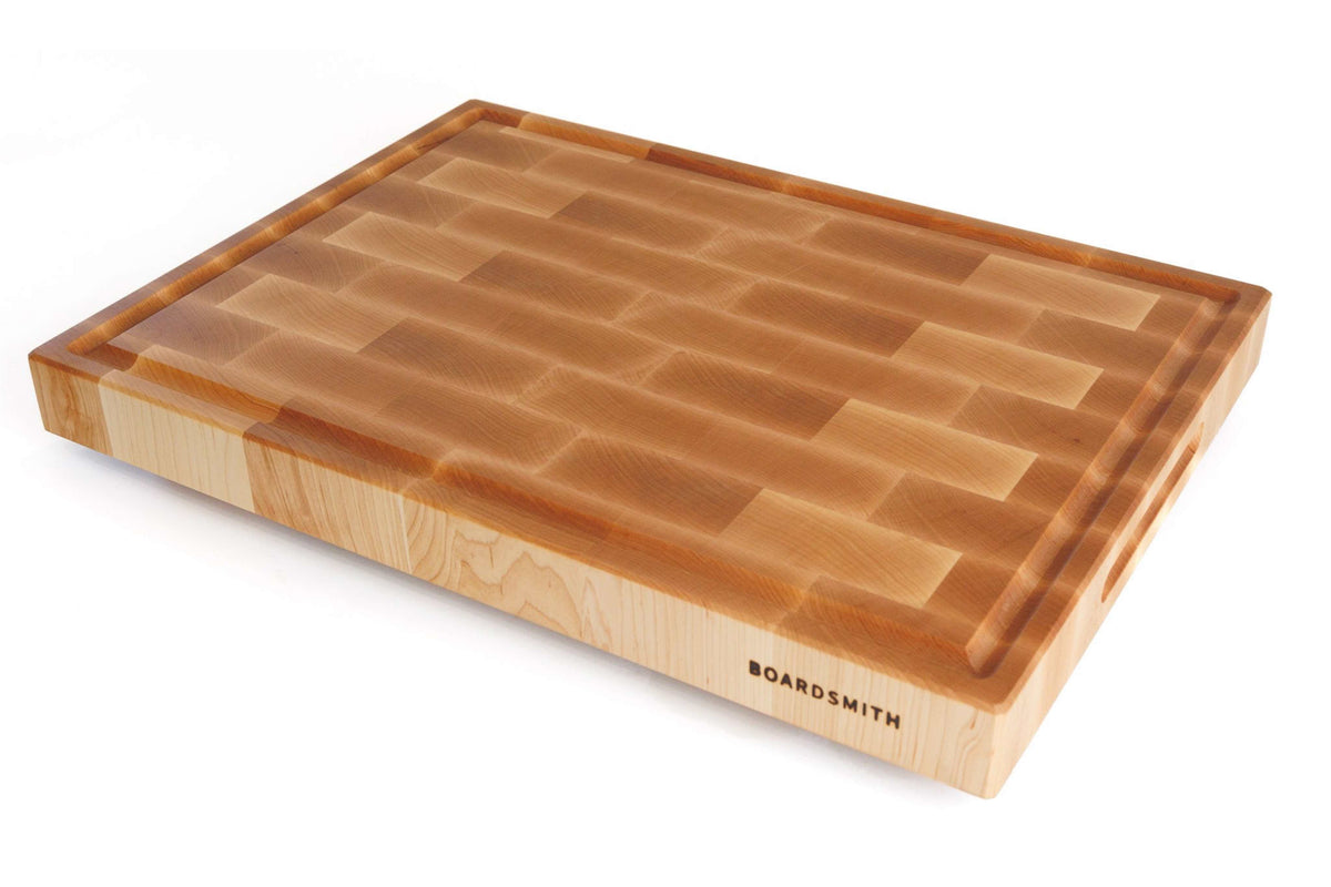 Handcrafted Maple End Grain Cutting Board by The Boardsmith showcasing detailed wood craftsmanship.